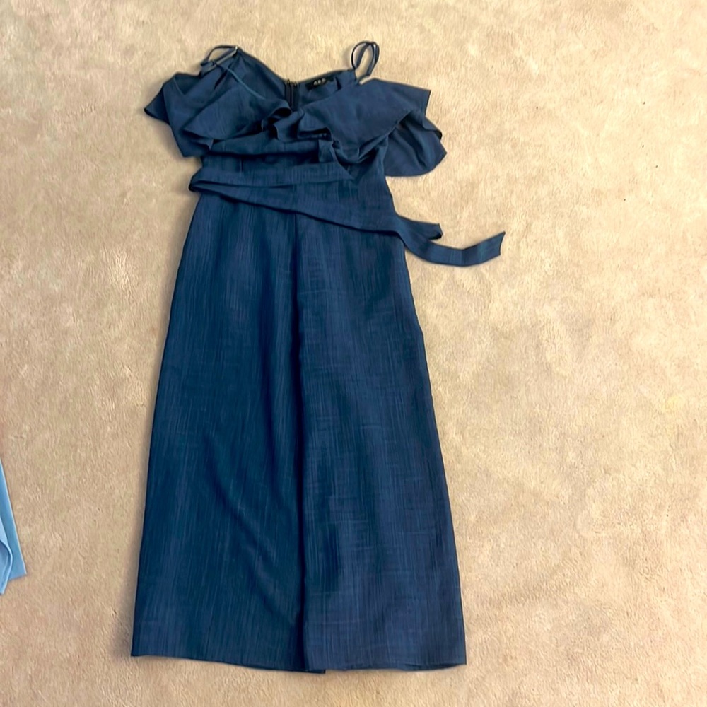 Beautiful blue one piece jumpsuit with adjustable straps and off the shoulder.